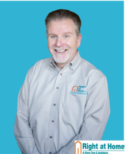 head shot with right at home on shirt