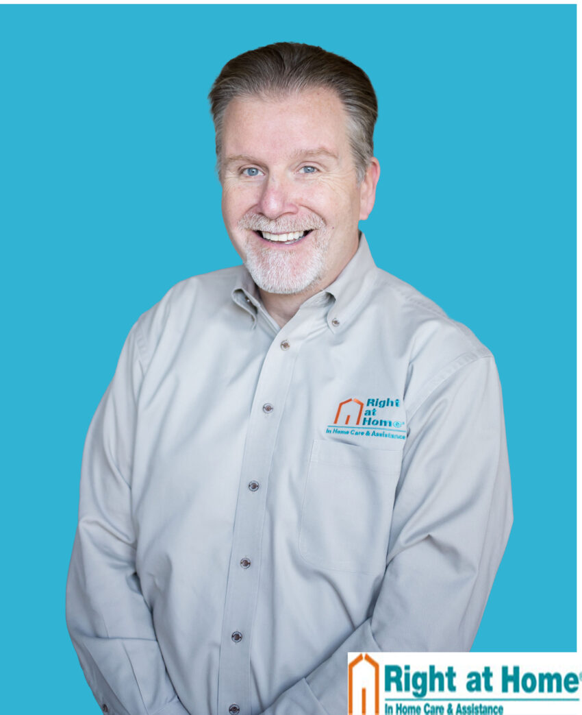 head shot with right at home on shirt